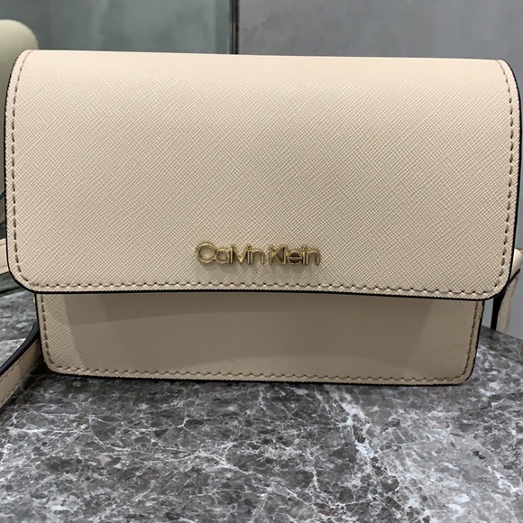 Calvin Klein being gorgeous mini clutch with adjustable strap. - Picture 2 of 4